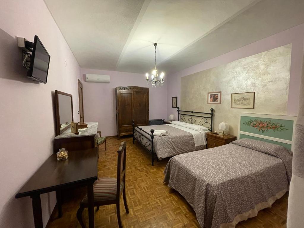 Postel nebo postele na pokoji v ubytování CA' DIJ SARACH