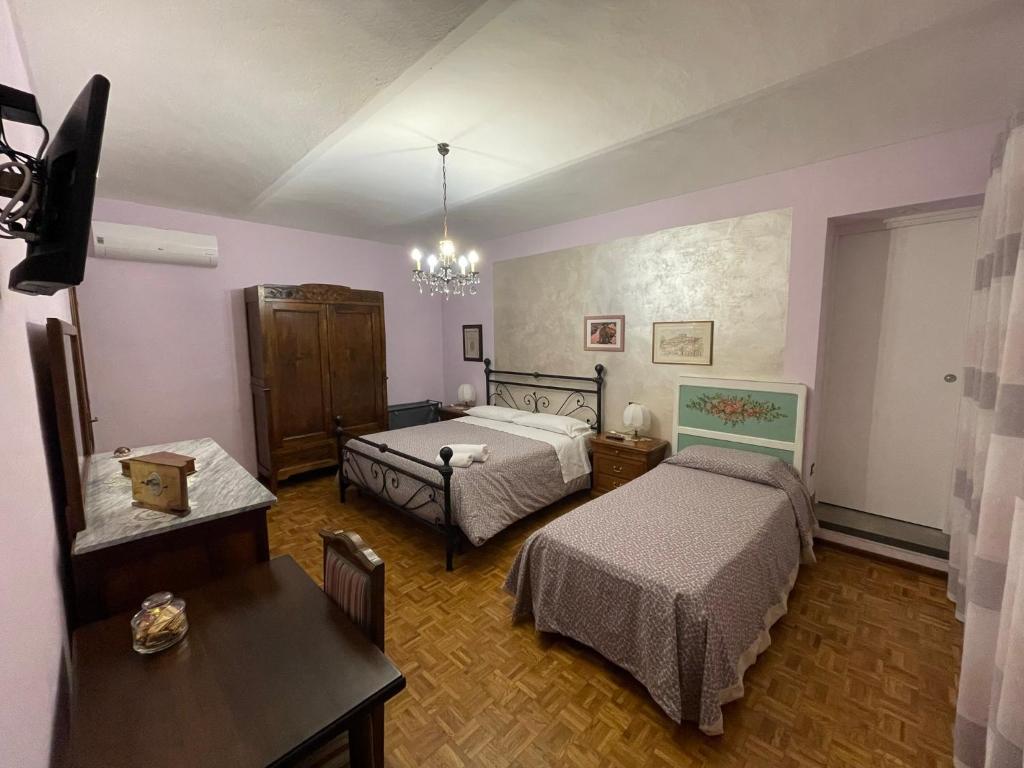 Postel nebo postele na pokoji v ubytování CA' DIJ SARACH