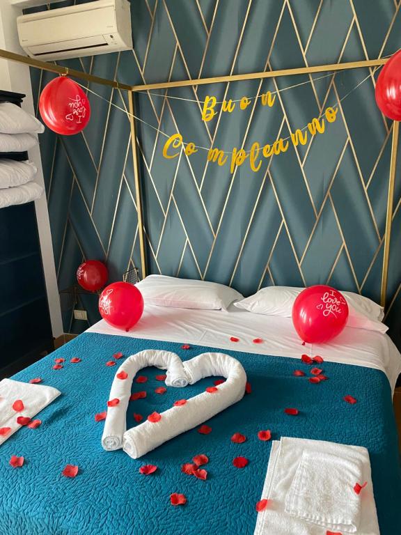 Łóżko lub łóżka w pokoju w obiekcie B&B Smeralda