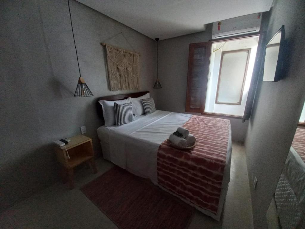 Postel nebo postele na pokoji v ubytování Meu Dengo Pousada
