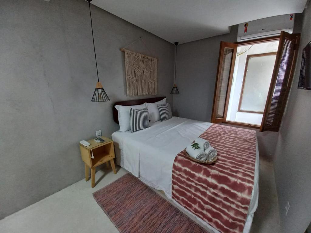 Postel nebo postele na pokoji v ubytování Meu Dengo Pousada