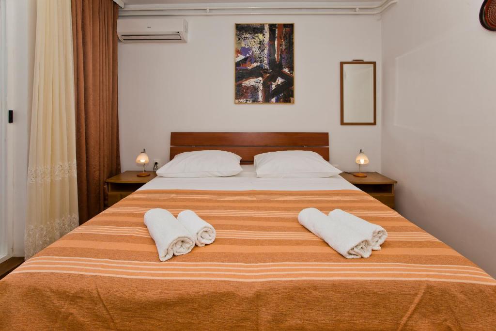 Postel nebo postele na pokoji v ubytování Guesthouse Aurora