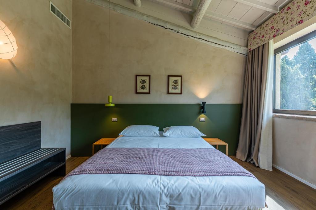 Postel nebo postele na pokoji v ubytování Relais Le Coste