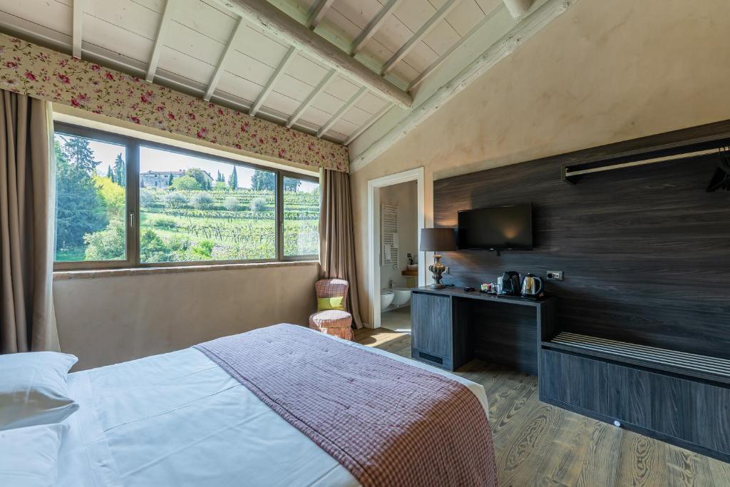 Postel nebo postele na pokoji v ubytování Relais Le Coste