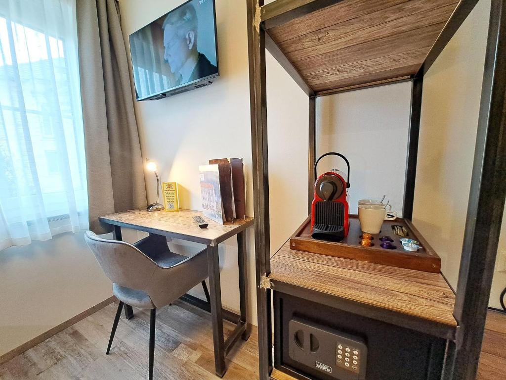 TV a/nebo společenská místnost v ubytování "Das Schlafzimmer" Erlebnis & Boutiquehotel - ehemals Hacienda Mexicana