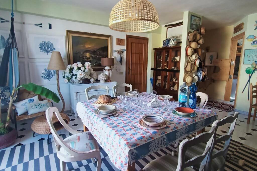 a dining room table with a table cloth on it at Centro Lampedusa via Roma in Lampedusa