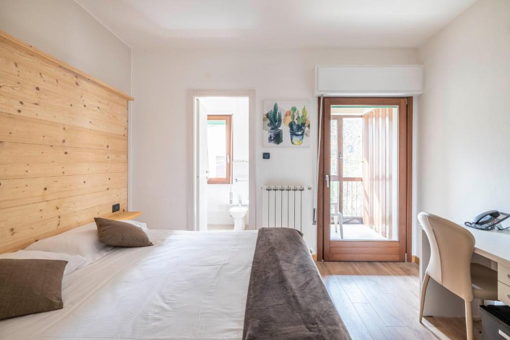 Postel nebo postele na pokoji v ubytování B&B Castello Cimbergo