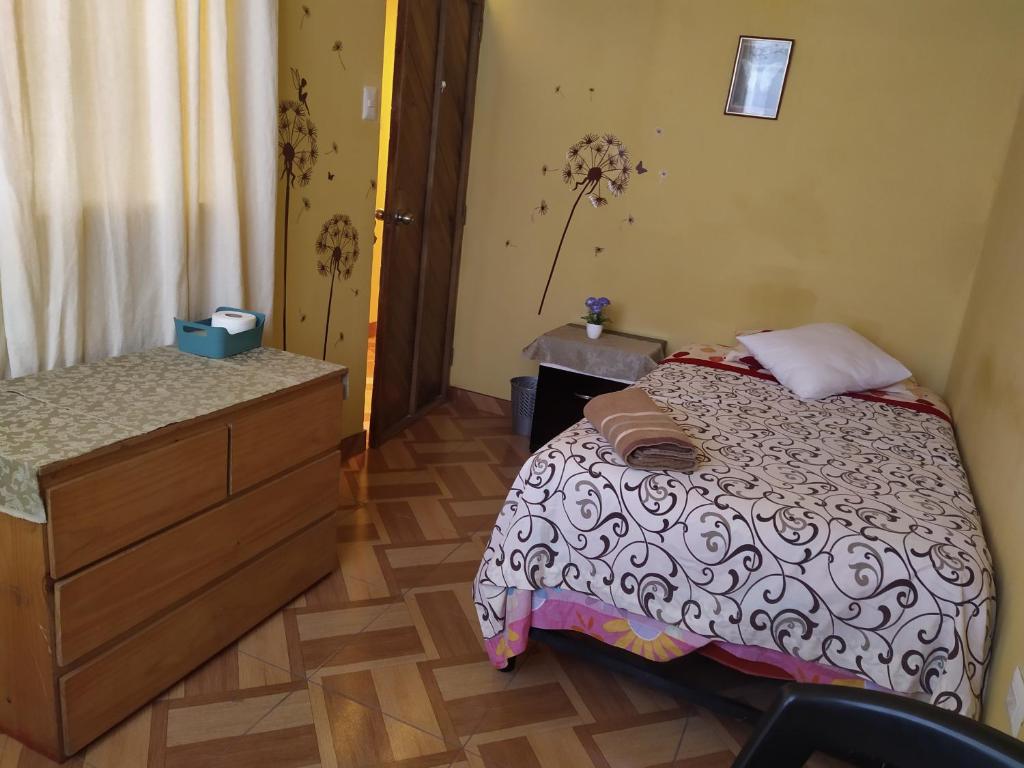Katil atau katil-katil dalam bilik di Villa Sol Host family