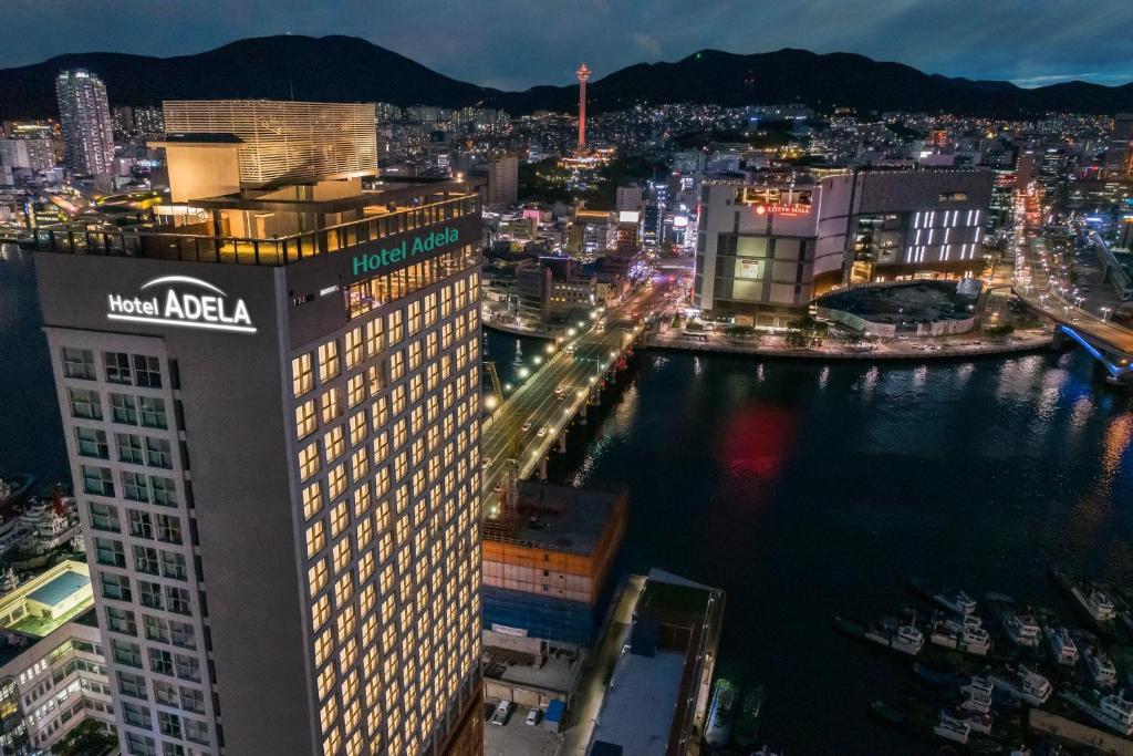 a view of a city at night at Hotel Adela in Busan