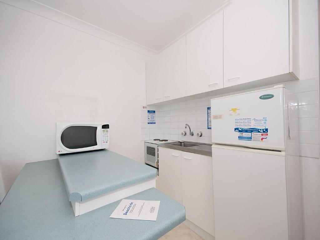 Kuchyň nebo kuchyňský kout v ubytování Beachside Shoal Bay Unit 2