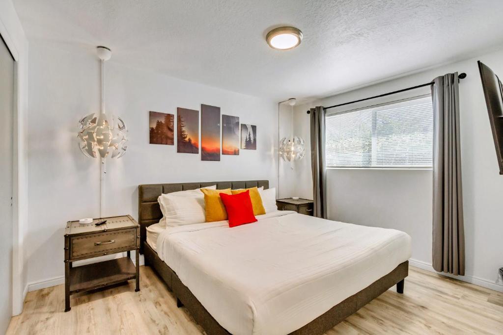 a bedroom with a large bed and a window at Near City Center - Full Kitchen - Fast Wi-Fi in Salt Lake City