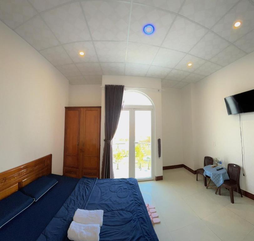 Giường trong phòng chung tại Homestay Hoài Tâm Phan Thiết