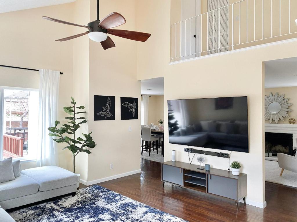 a living room with a couch and a ceiling fan at Reno Gem 3 and a half Miles to DT, 40 Miles to Tahoe in Reno