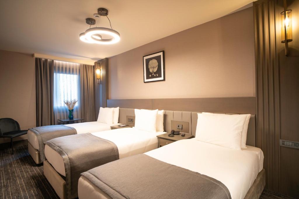 Arts Hotel Taksim客房内的一张或多张床位