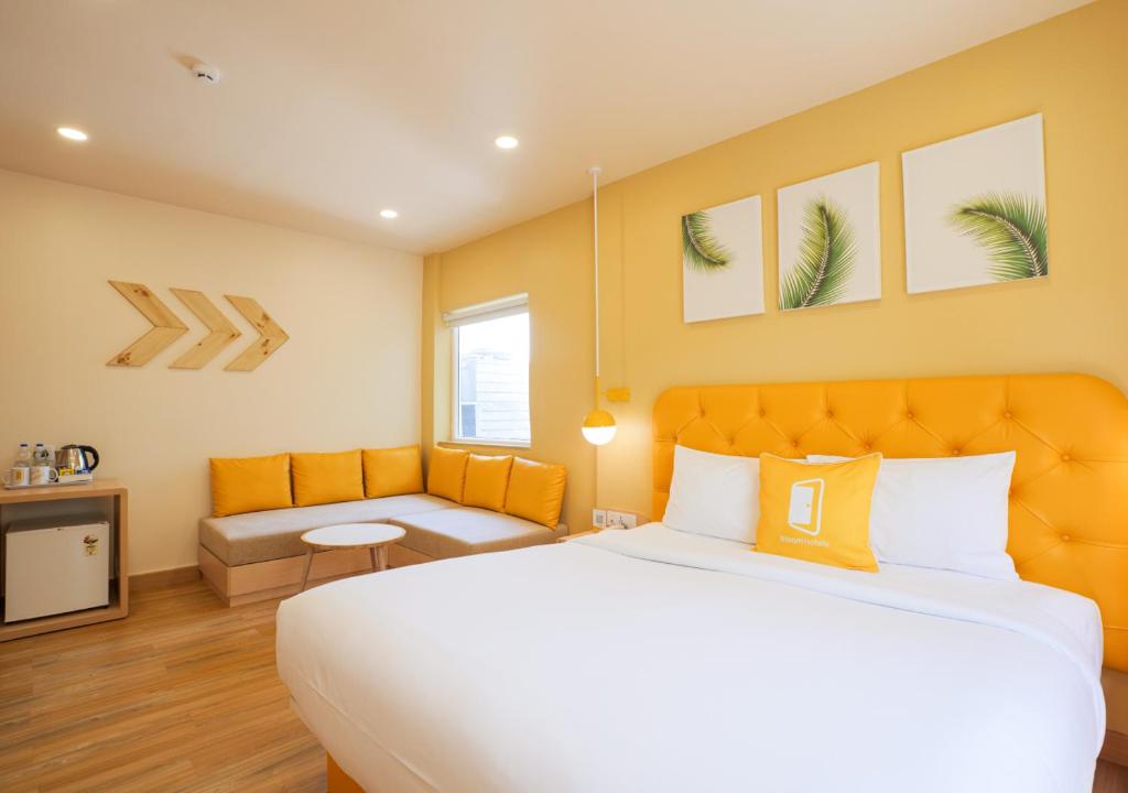Postel nebo postele na pokoji v ubytování Bloom Hotel Koramangala