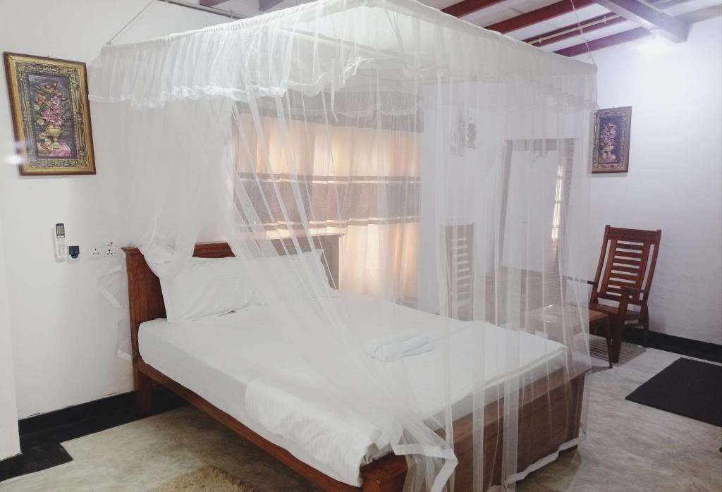 Postel nebo postele na pokoji v ubytování SK HOUSE RESORT UNAWATUNA