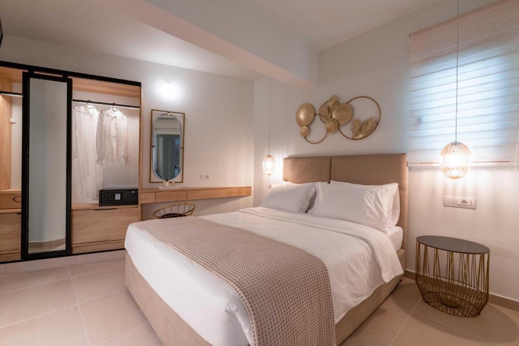 Postel nebo postele na pokoji v ubytování Mariann Premium Suites