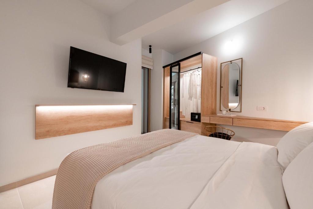 Postel nebo postele na pokoji v ubytování Mariann Premium Suites