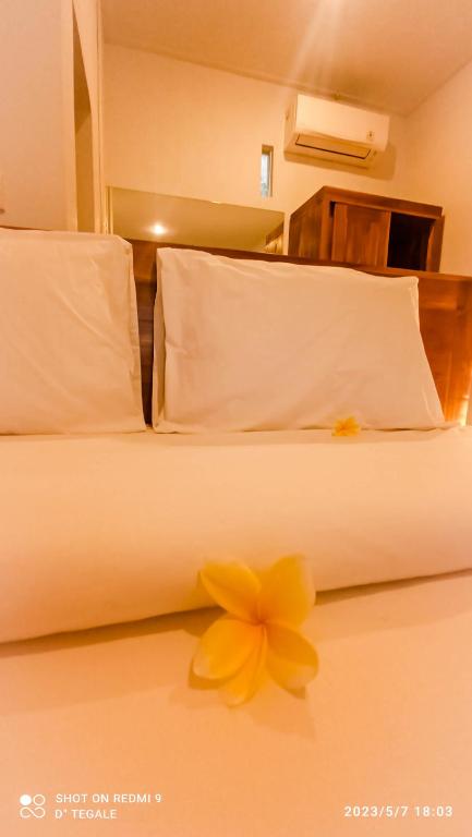Postel nebo postele na pokoji v ubytování D' Tegal House