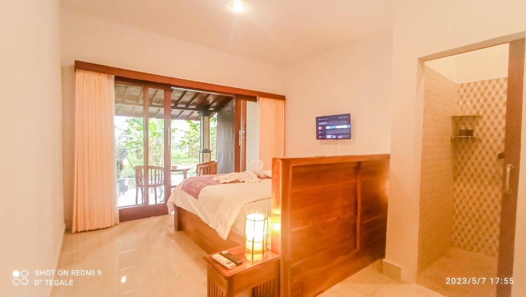 Postel nebo postele na pokoji v ubytování D' Tegal House