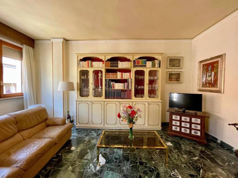 a living room with a couch and a coffee table at Careggi Gold Colors in Florence