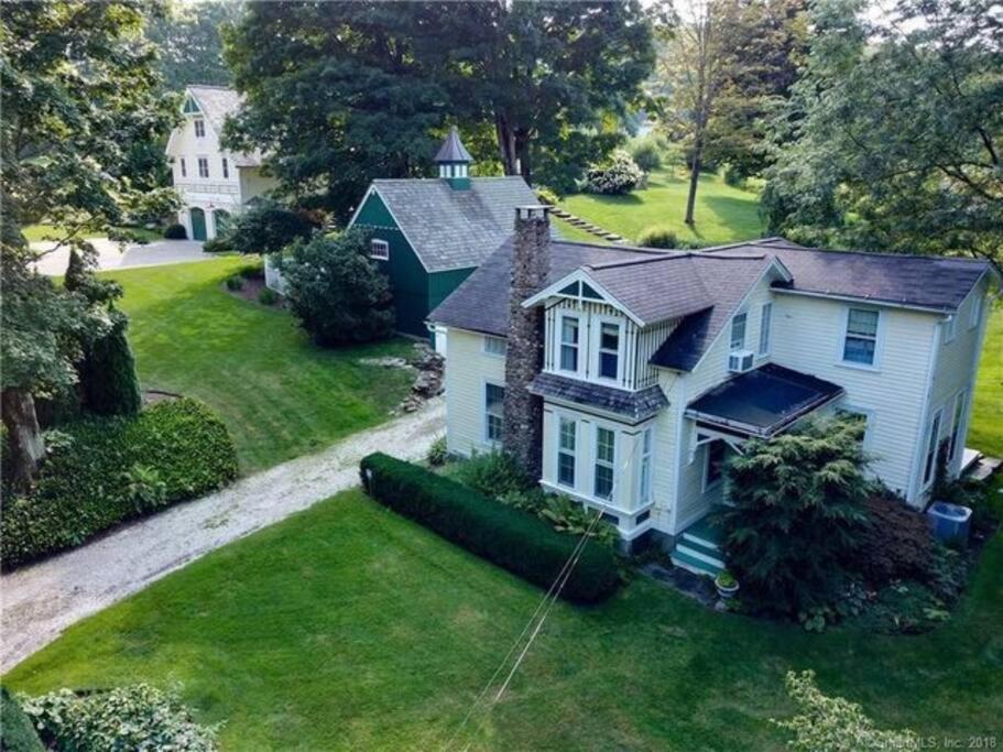 an aerial view of a white house at Tophet Road, 3-BR with Spa Plunge Pool - PoshPadsCT in Roxbury