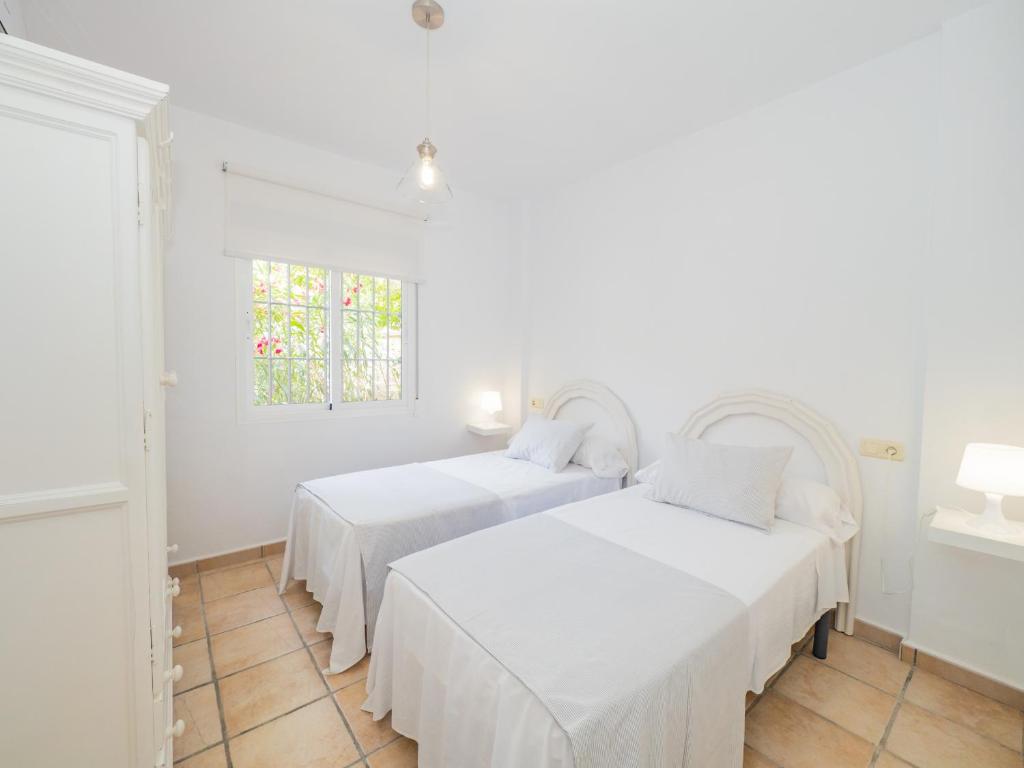 Postel nebo postele na pokoji v ubytování Cubo's Villa La Quinta