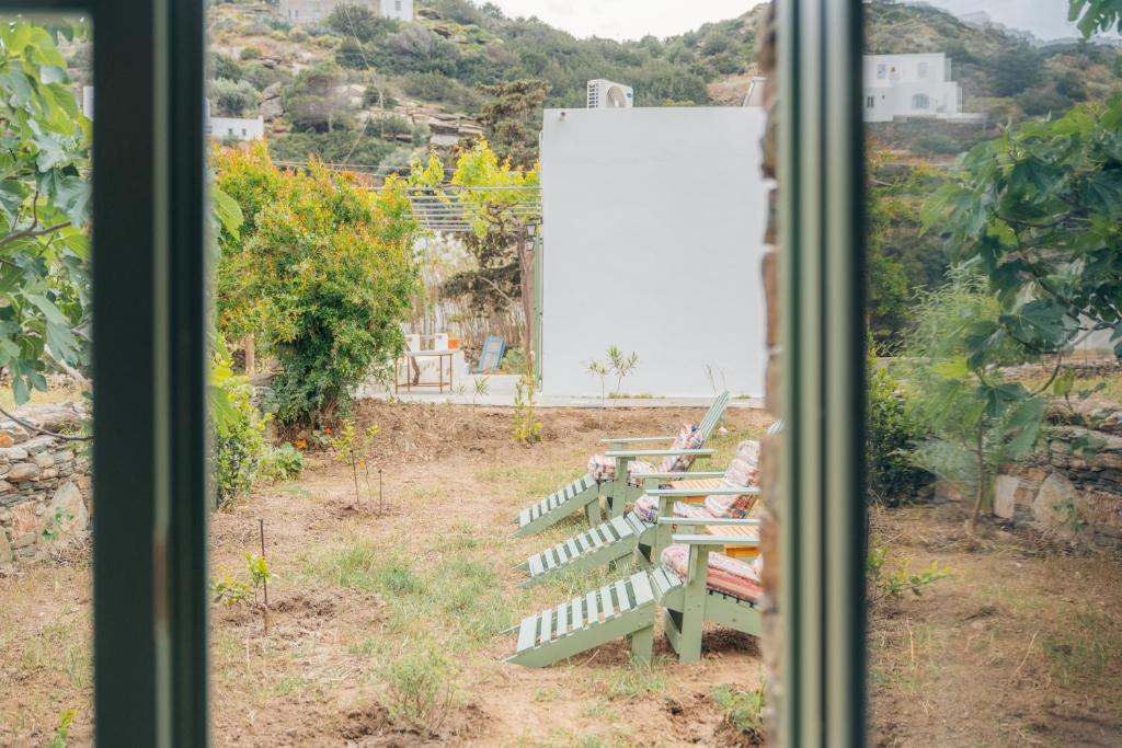 a view of a bench from a window at Houses at Chrisopigi Sifnos in Chrisopigi