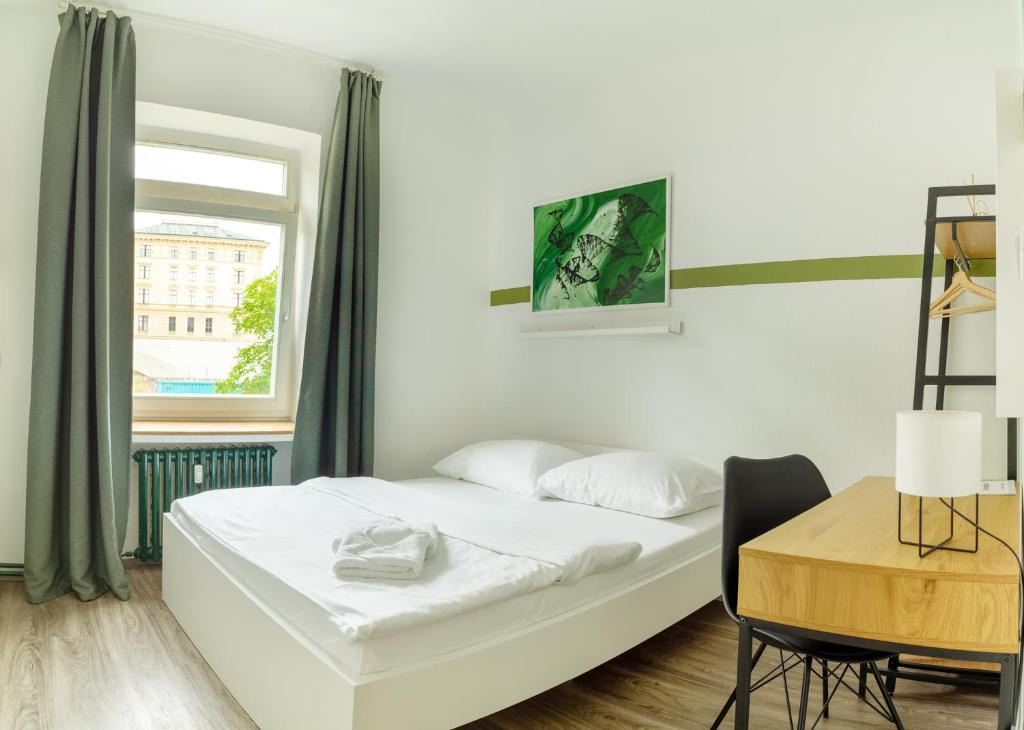 Postel nebo postele na pokoji v ubytování Internesto Brno