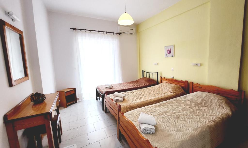 A bed or beds in a room at VILLA ELENA