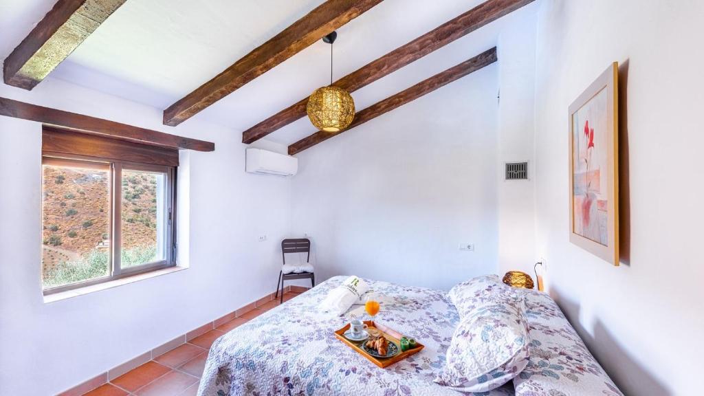 Postel nebo postele na pokoji v ubytování Cortijo Maravilla Frigiliana by Ruralidays