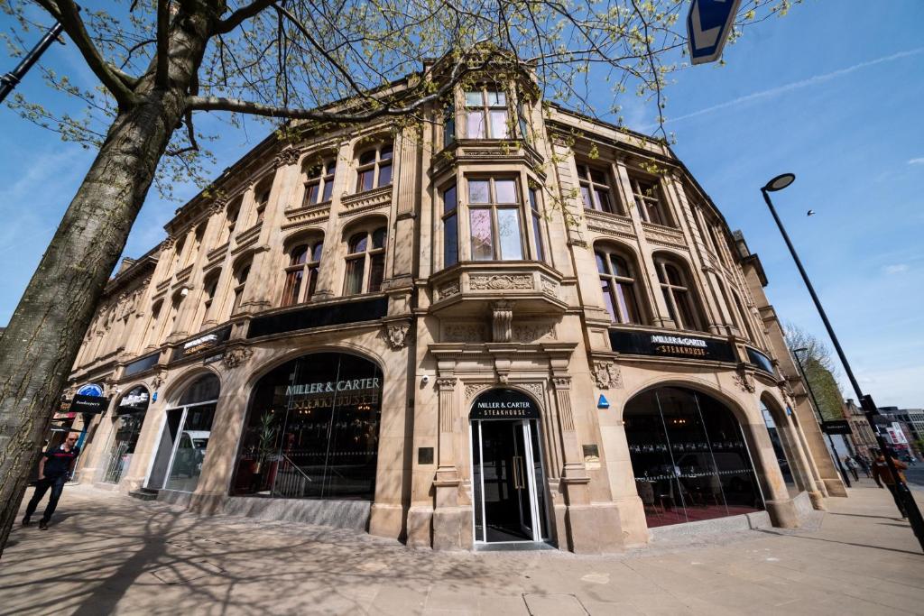 a large building on the corner of a street at Miller & Carter Sheffield by Innkeeper's Collection in Sheffield