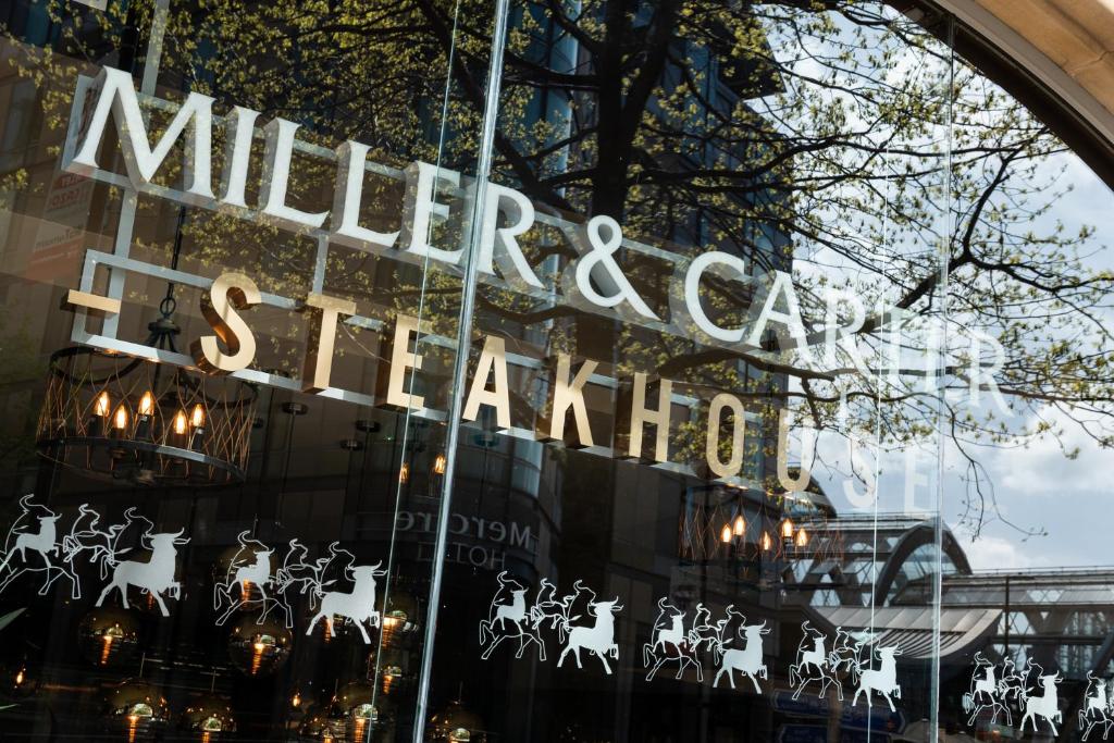 a store window with a sign that reads mulberry car dealership at Miller & Carter Sheffield by Innkeeper's Collection in Sheffield
