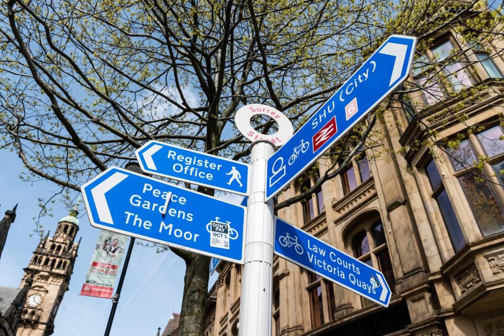 a street sign with many signs on a pole at Miller & Carter Sheffield by Innkeeper's Collection in Sheffield
