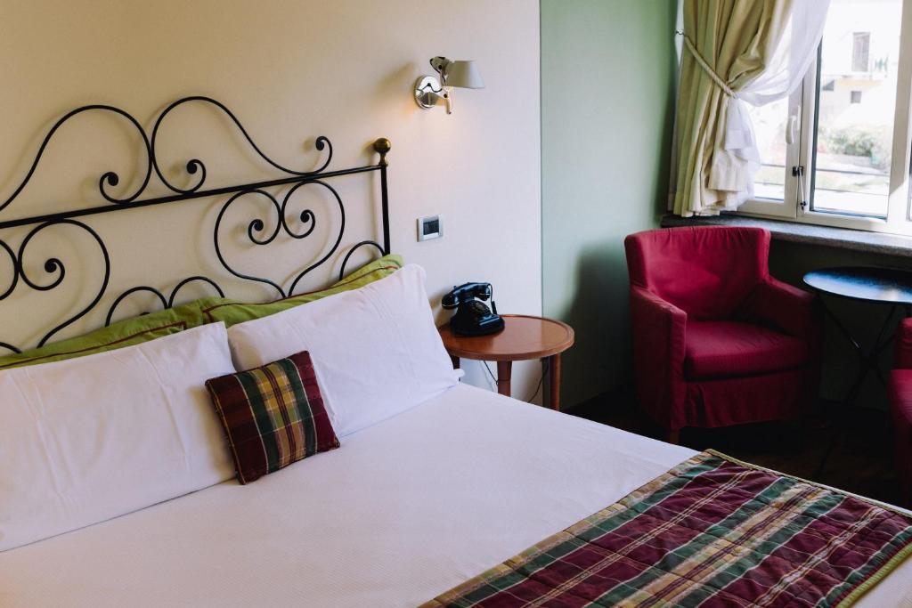 Postel nebo postele na pokoji v ubytování Bijou Hotel