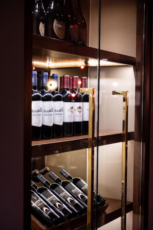 a cabinet filled with lots of bottles of wine at Miller & Carter Sheffield by Innkeeper's Collection in Sheffield
