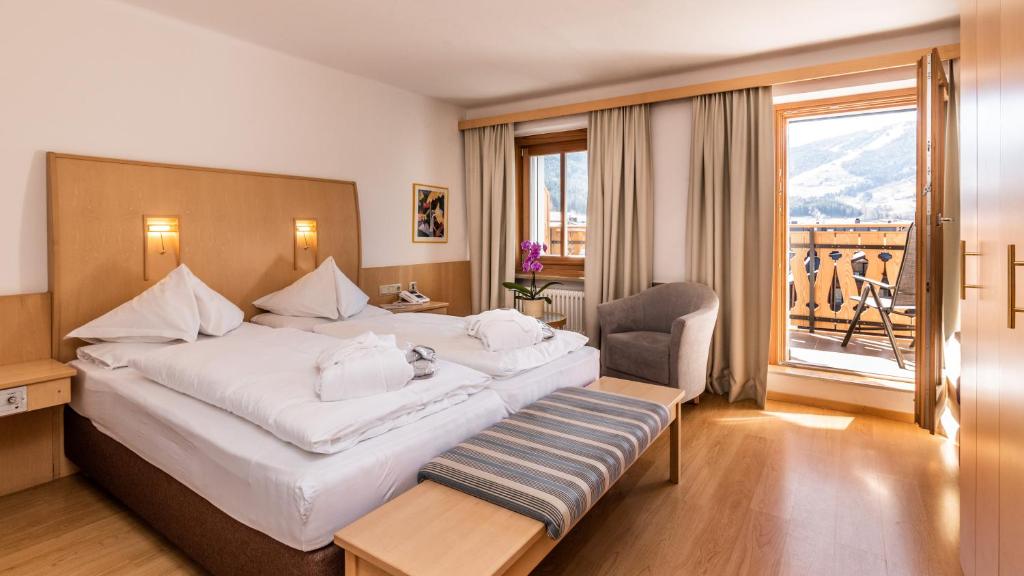 Postel nebo postele na pokoji v ubytování Hotel Post - OlangCard included