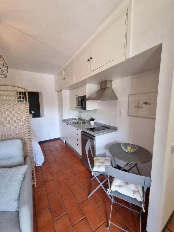 Kuchyň nebo kuchyňský kout v ubytování Apartamento con Patio Sevillano