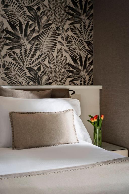 Postel nebo postele na pokoji v ubytování Hotel Maestrale
