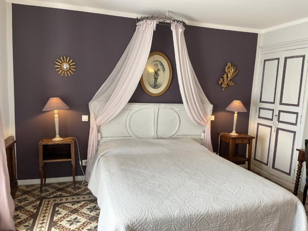 Postel nebo postele na pokoji v ubytování LA MAISON DE JUSTINE