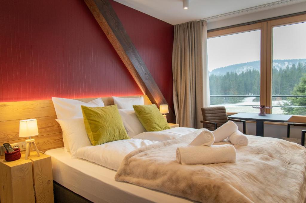 Postel nebo postele na pokoji v ubytování Terre de Sapins - Gîtes nature haut de gamme avec sauna au cœur du Lac Blanc
