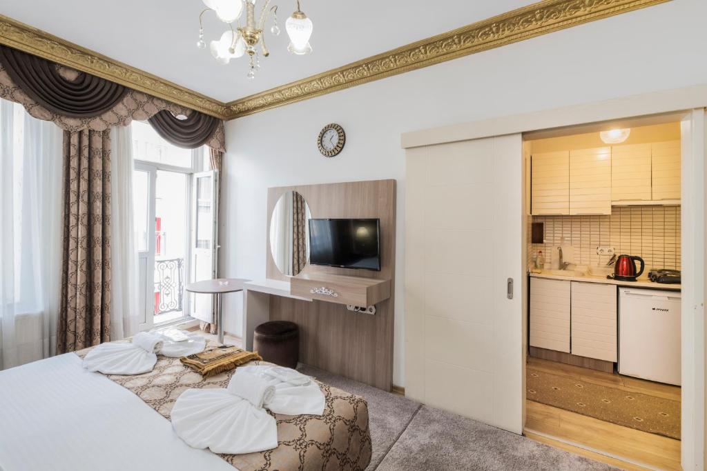 Postel nebo postele na pokoji v ubytování Punto Suite