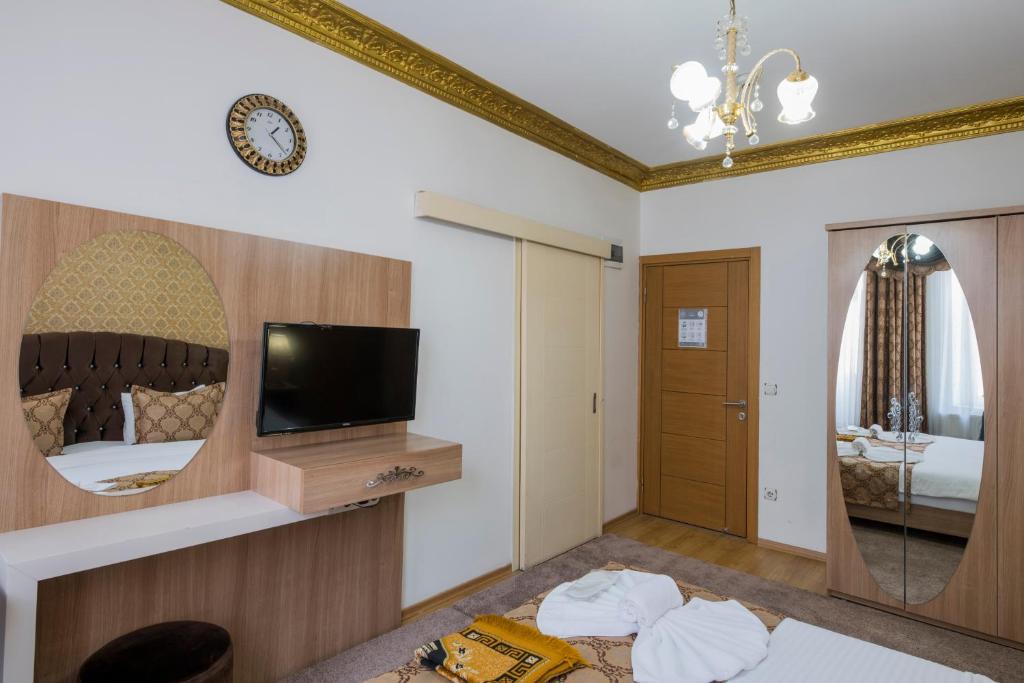 TV a/nebo společenská místnost v ubytování Punto Suite