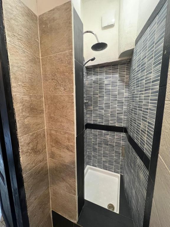 a bathroom with a shower with a toilet and a sink at Ambra Boutique Hotel in Milan