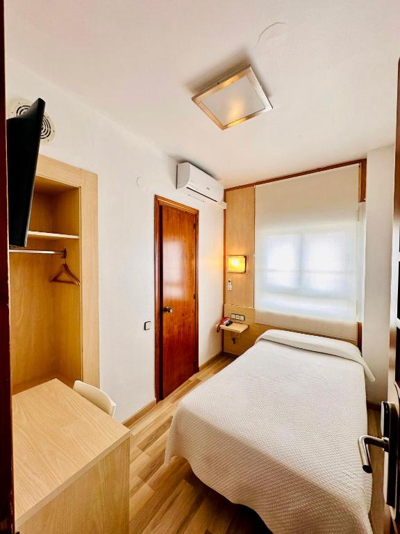 Postel nebo postele na pokoji v ubytování Tortosa Parc