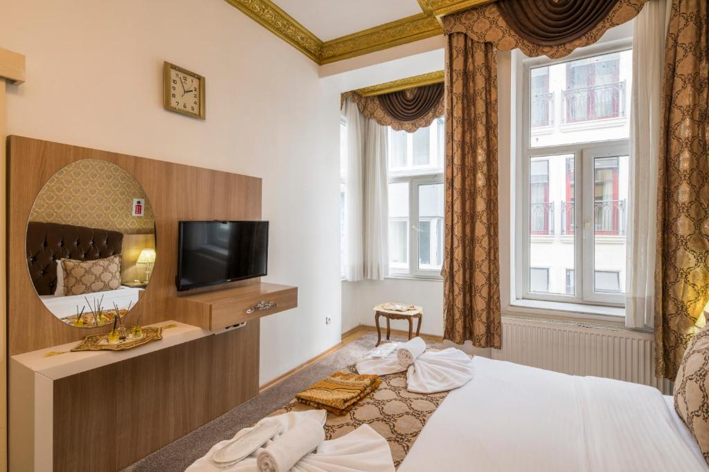 Postel nebo postele na pokoji v ubytování Punto Suite