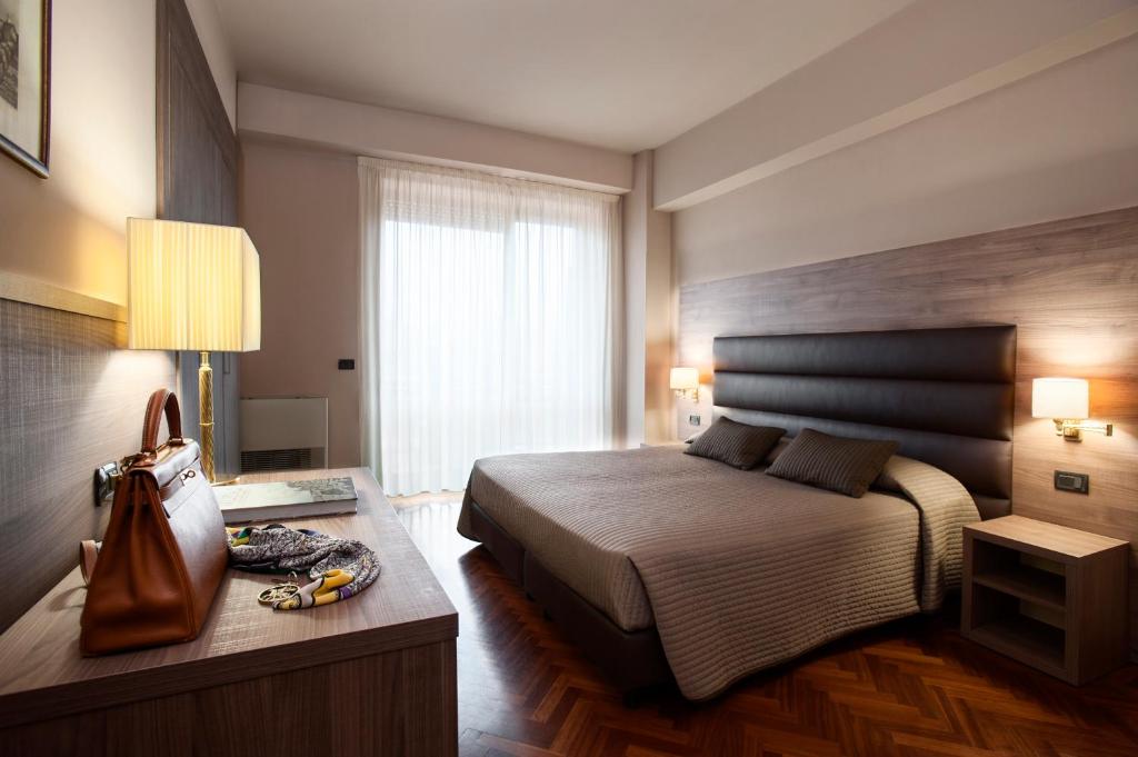 Postel nebo postele na pokoji v ubytování Hotel San Giorgio