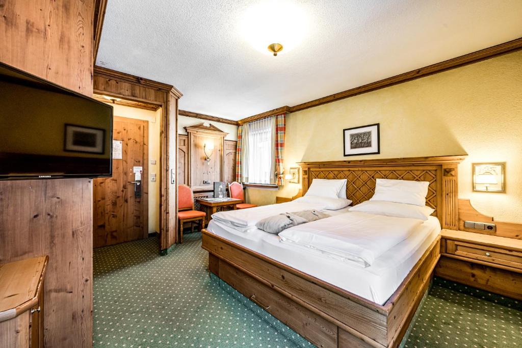 Postel nebo postele na pokoji v ubytování Hotel Alpina Sölden - Adults Only