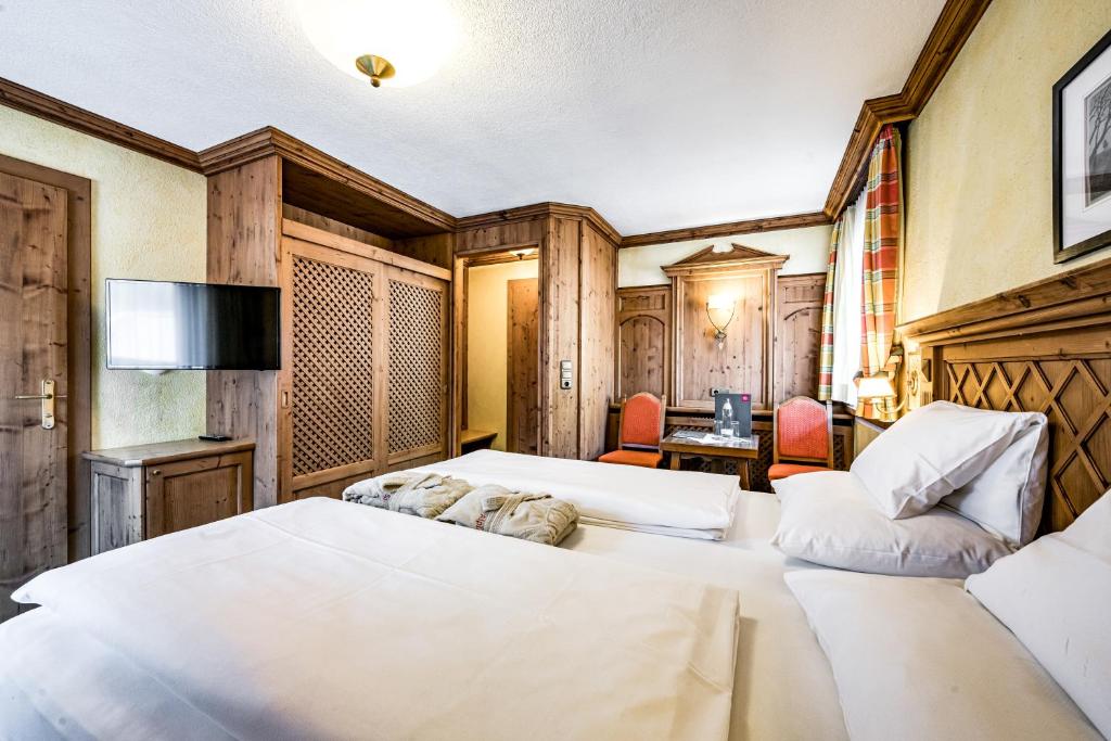 Postel nebo postele na pokoji v ubytování Hotel Alpina Sölden - Adults Only