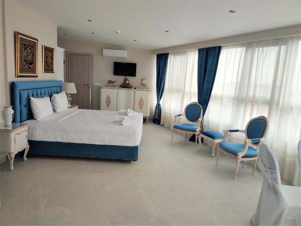 Postel nebo postele na pokoji v ubytování Light Blue Hotel